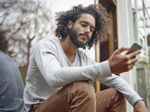 Young man looking at cell phone